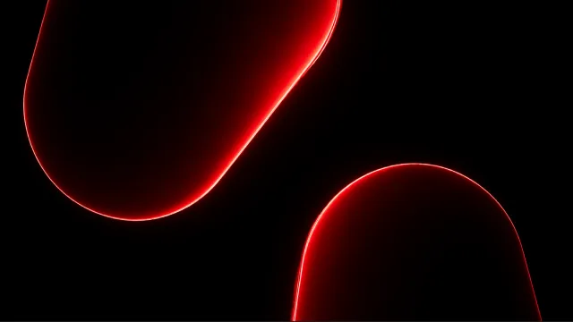 Two rounded shapes outlined in red light.